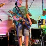 Ocracoke Island music prodigy Dallas Mason takes on the guitar
