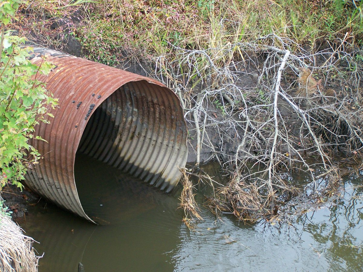 Water drains from a pipe in this file photo. The proposed rule change would allow domestic wastewater discharges into zero-flow streams in the state.
